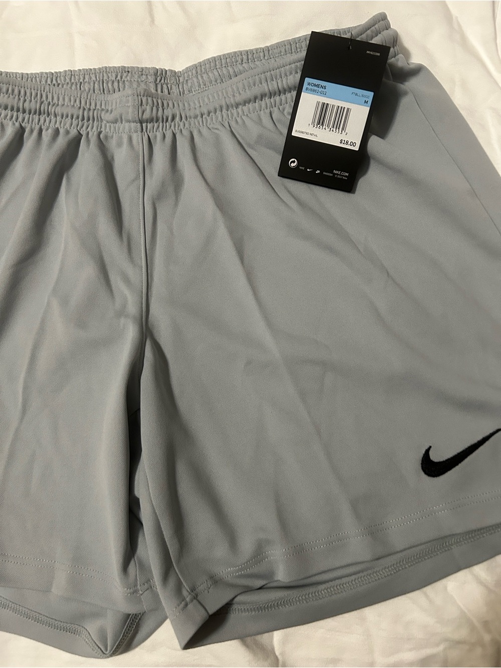 Nike Women's Light Gray Athletic Shorts with Black Swoosh